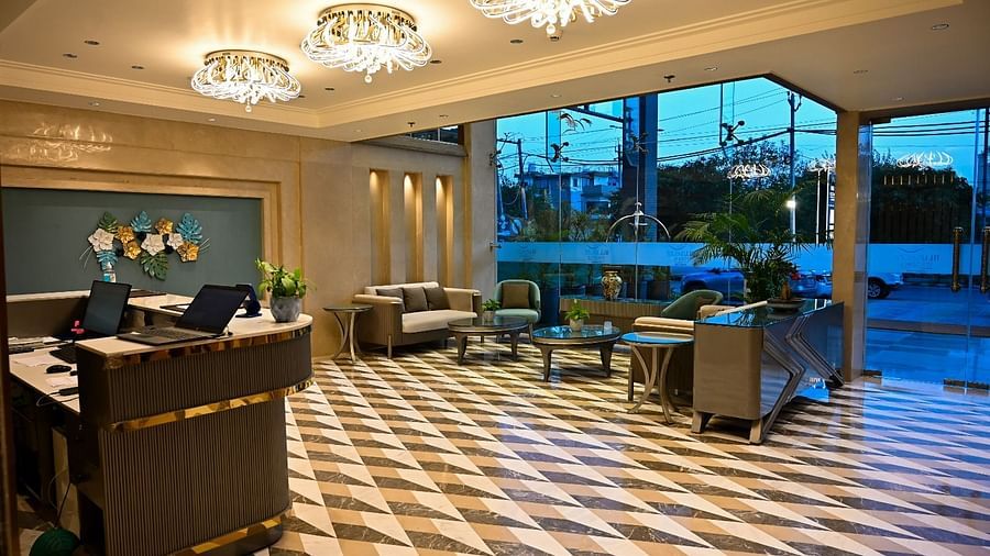 A spacious lobby featuring comfortable seating arrangements and a reception desk at 